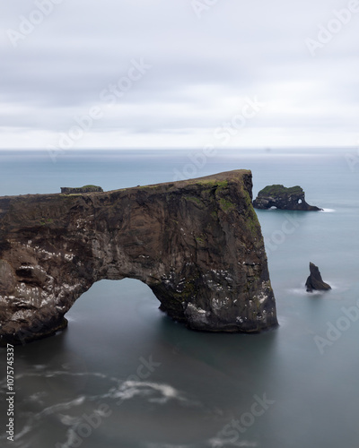 Arch cliff in Iceland over the sea