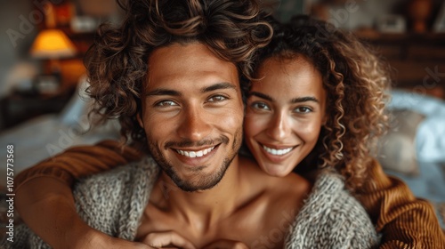 Young couple making heart shape with hands at home, smiling at camera, hyper realistic high resolution photo