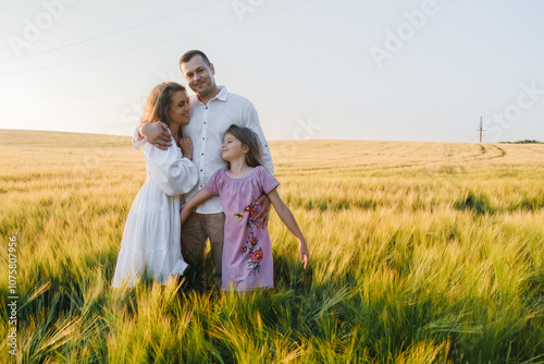 Love and happiness family together in wheat field.