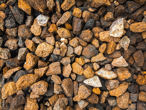 Brown, black, gray and yellow pebbles pattern for background, Material and Mineral Surface art wallpaper concept