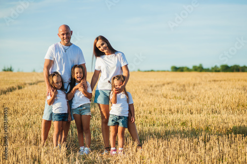 Happy family in the field.Family, selfie and nature with flowers, field and trees for bonding, love and social media together outdoor. Woman, kid and man playing at park in summer for happy.