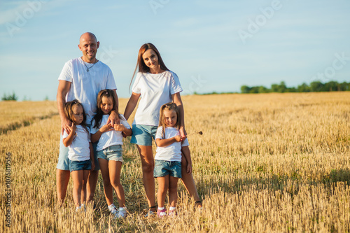 Happy family in the field.Family, selfie and nature with flowers, field and trees for bonding, love and social media together outdoor. Woman, kid and man playing at park in summer for happy.