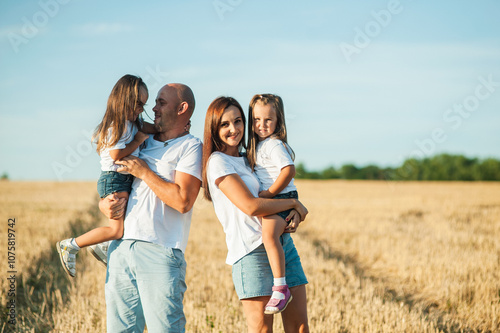 Happy cheerful family has a day off.Family, and nature with flowers, field and trees for bonding, love and social media together outdoor. Woman, kid and man playing at park in summer for happy.