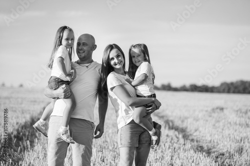 Beautiful family posing in the park.Black and white photo of a happy family.