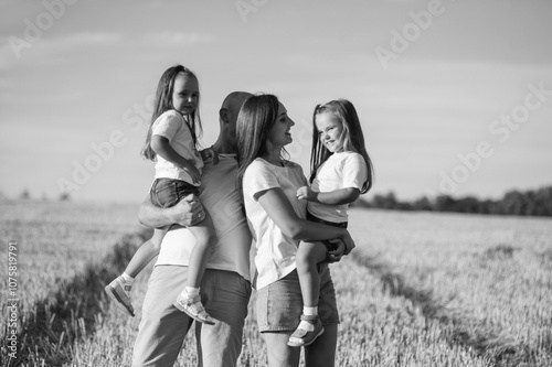 Beautiful family posing in the park.Black and white photo of a happy family.