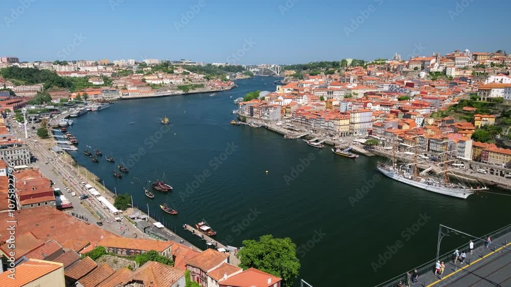 View of Porto city and Douro river and Dom Luis I bridge with metro tram from famous tourist viewpoint Miradouro da Serra do Pilar. Porto, Vila Nova de Gaia, Portugal View of Porto city and Douro river and Dom Luis I bridge with metro tram from famous tourist viewpoint Miradouro da Serra do Pilar. Porto, Vila Nova de Gaia, Portugal