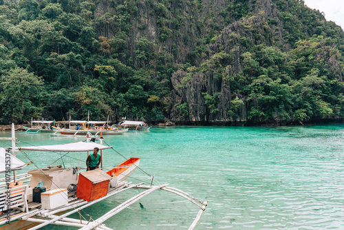 Bangka Boat on Lagoon in the Philippines photo