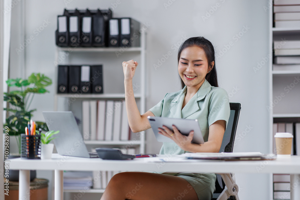 Happy Asian Business woman using calculator and laptop for doing math finance on an office desk, tax, report, accounting, statistics, and analytical research concept
Happy Asian Business woman using calculator and laptop for doing math finance on an office desk, tax, report, accounting, statistics, and analytical research concept