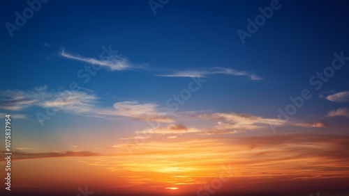 Warm sunset with sky gradient shifting from blue to orange, serene atmosphere 