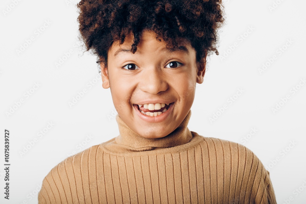 Portrait of a surprised young african american boy with mouth open expressing shock on a plain white background Portrait of a surprised young african american boy with mouth open expressing shock on a plain white background