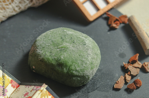 Wallpaper Mural Kusa mochi (also known as yomogi mochi) on a black plate, this tractional Japanese confection is made from mochi and leaves of yomogi (Japanese mugwort) Torontodigital.ca