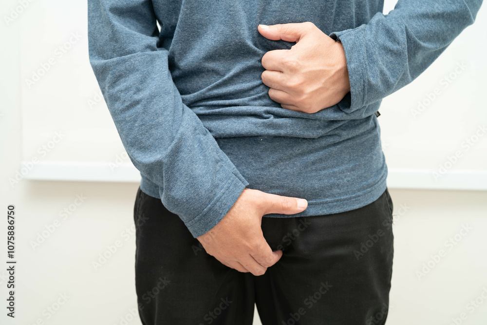 Fototapeta premium Hernia, Asian man stomach ache, abdominal pain and urology problem health.