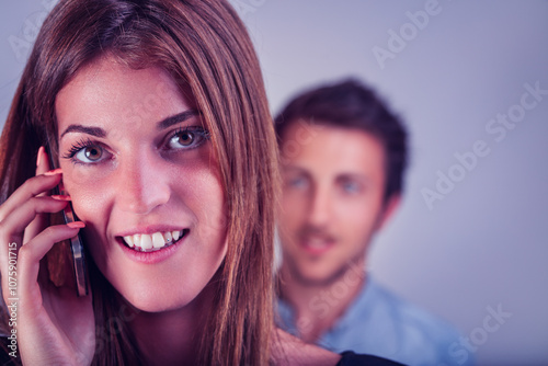 Woman’s privacy contrasts with man’s concerned, suspicious g photo