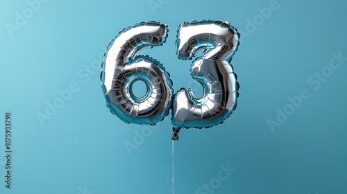 Silver Number 63 Balloons on Blue Background.