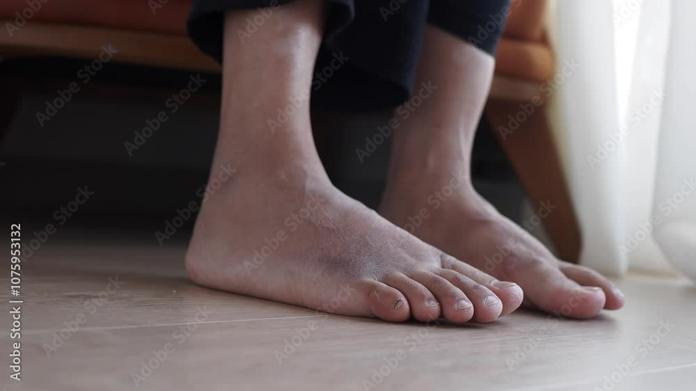 A CloseUp View of Bare Feet Relaxing Comfortably on a Floor in a Calm Environment A CloseUp View of Bare Feet Relaxing Comfortably on a Floor in a Calm Environment