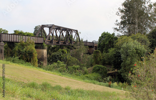 Railway bridge spanning a valley with trees and grass in Kyogle in New South Wales, Australia