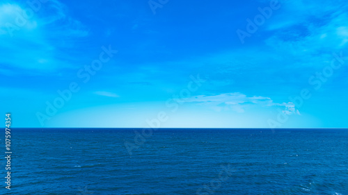 Nature of the beach and sea Summer with sunshine, sandy beaches, clear blue waters sparkling against the blue sky. On an island with good ecology and environment Background for summer vacation concept