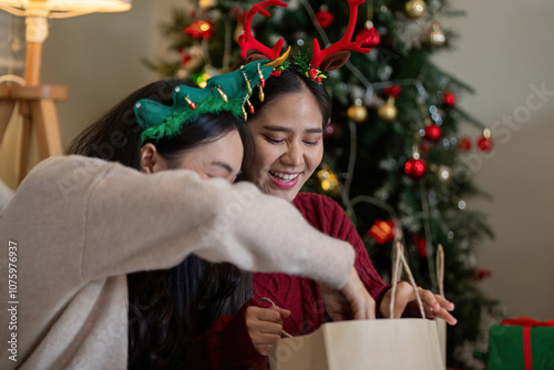 Delighted Lesbian Couple Unwrapping Holiday Treasures with Glee