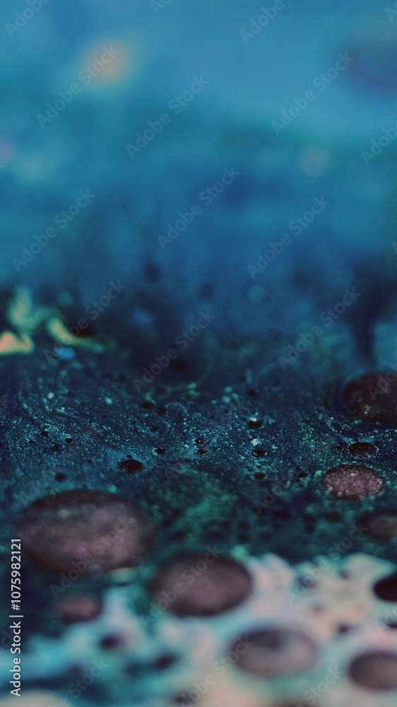 Vertical video. Glitter foam. Ink bubbles. Defocused blue pink black color shimmering particles texture oil paint mix wave round blob abstract art background. Vertical video. Glitter foam. Ink bubbles. Defocused blue pink black color shimmering particles texture oil paint mix wave round blob abstract art background.