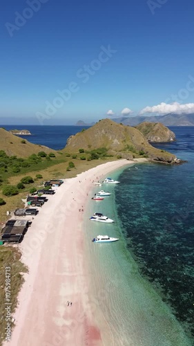 Drone shoot of Pink Beach in Labuan Bajo and travel tourism boat docking