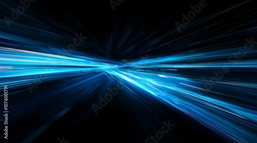 Dynamic blue light trails on black background depict abstract long exposure highway at night with illusion of speed.