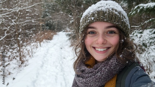 Woman Smiling in Snowy Forest with a Knitted Hat