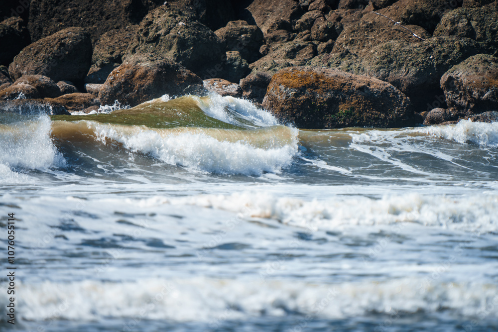 Closeup of waves crashing and sea foam on Pacific Ocean coastal shoreline Washington state Closeup of waves crashing and sea foam on Pacific Ocean coastal shoreline Washington state