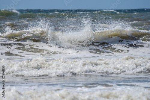 Fototapeta Naklejka Na Ścianę i Meble -  Closeup of waves crashing, ocean spray, and sea foam on Pacific Ocean coastal shoreline Washington state