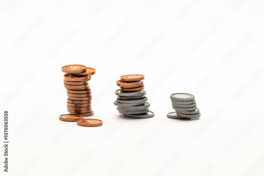 US coin ascending like a bar graph isolated on white table US coin ascending like a bar graph isolated on white table