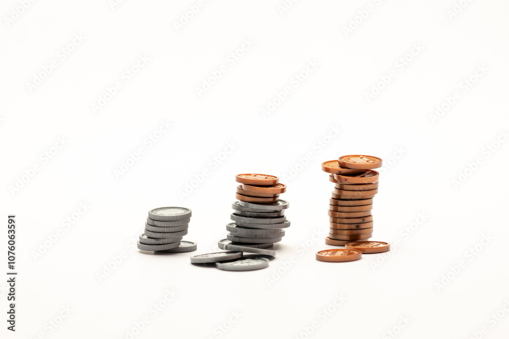 US coin increasing like a bar graph isolated on white table US coin increasing like a bar graph isolated on white table