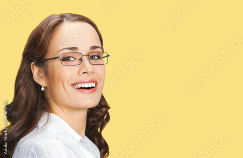 Face portrait image of happy smiling business woman businesswoman, teacher, bank manager, real estate agent. Confident brunette girl wear glasses, white shirt. Isolate yellow background. Dental care.