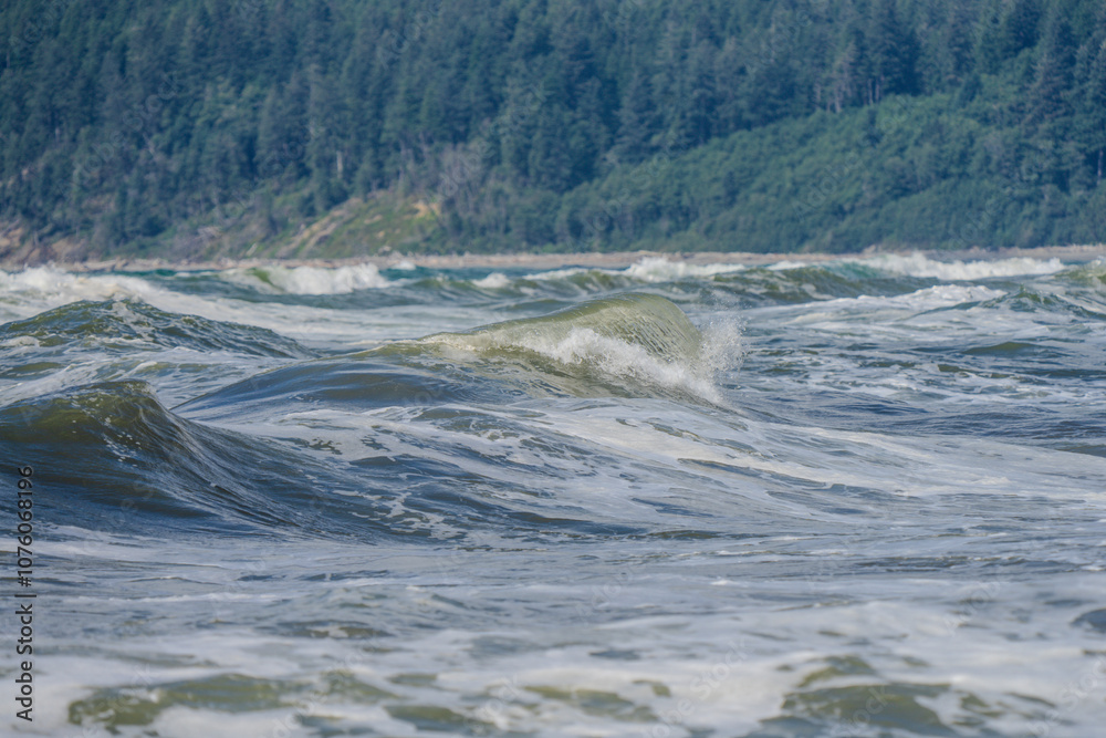 Closeup of waves crashing and sea foam on Pacific Ocean coastal shoreline Washington state Closeup of waves crashing and sea foam on Pacific Ocean coastal shoreline Washington state