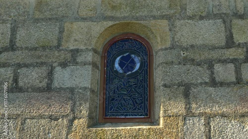 Close-up of stone window at Santa María de Parada de Outeiro church, Vilar de Santos, Spain photo