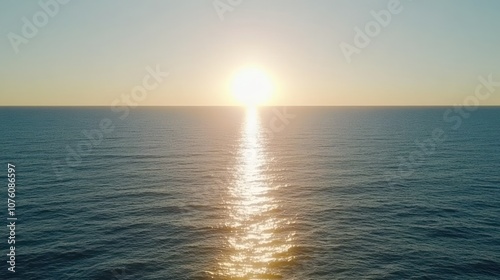 A serene sunset over the ocean, reflecting light on calm waters.