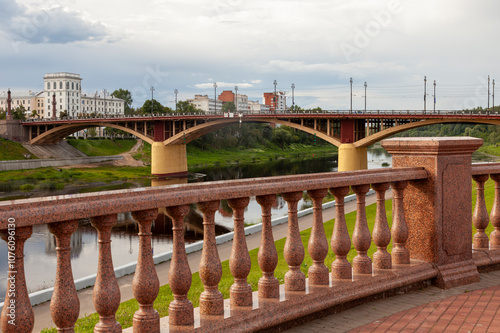 Arched bridge across the Western Dvina River in the center of Vitebsk, Belarus photo