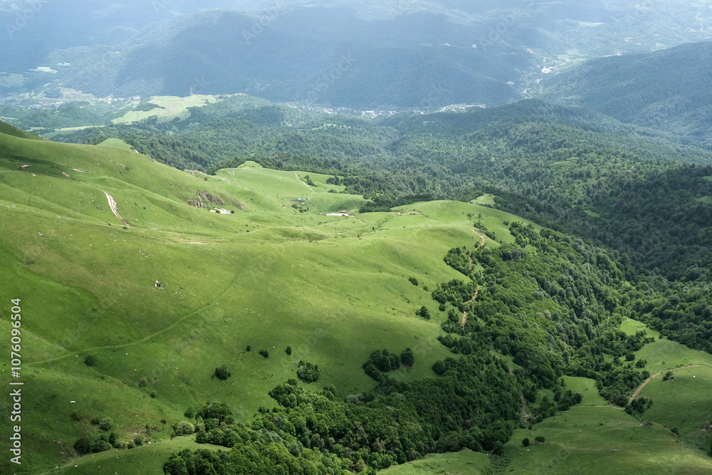 Obraz premium View of Haghartsin village and Aghstev river valley from Mount Dimats on sunny summer day. Tavush Province, Armenia..