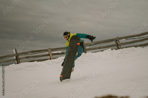 attempting a trick on a snowboard