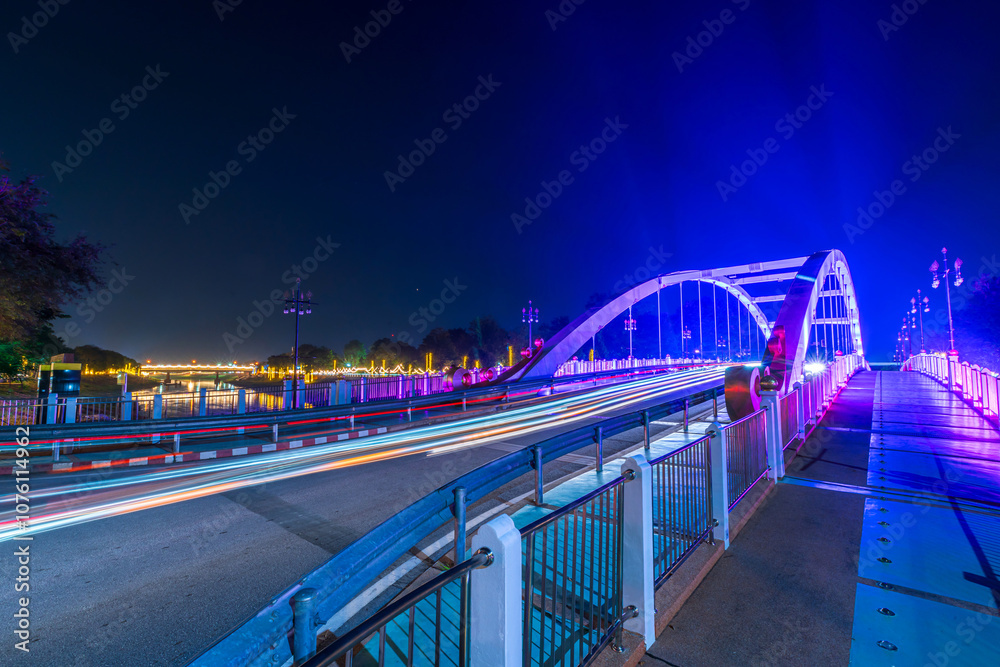 Obraz premium light Chan Palace Bridge over the Nan River Chan Palace bridge for The Loy Krathong festival 2024 at night in Phitsanulok, the full moon of the 12th month Be famous festival of Thailand.