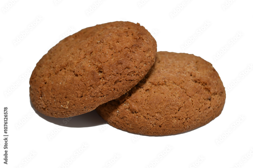 Round shaped oatmeal cookies lie on a white background. Round shaped oatmeal cookies lie on a white background.