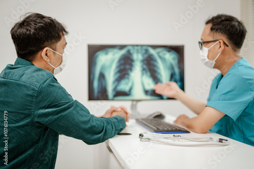 Doctor explaining lung cancer stages on a digital screen showing detailed lung diagrams, representing knowledge and guidance, modern and educational.