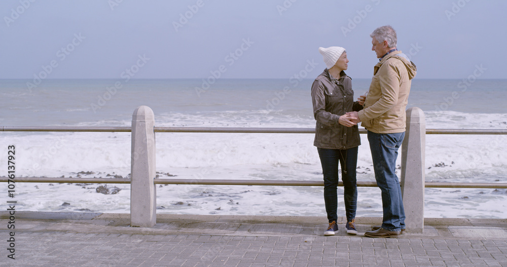 Mature couple, holding hands and support by ocean, water and beach for love, partner and bonding. Woman, man and affection in relationship, marriage and care with outdoor or space on holiday together Mature couple, holding hands and support by ocean, water and beach for love, partner and bonding. Woman, man and affection in relationship, marriage and care with outdoor or space on holiday together