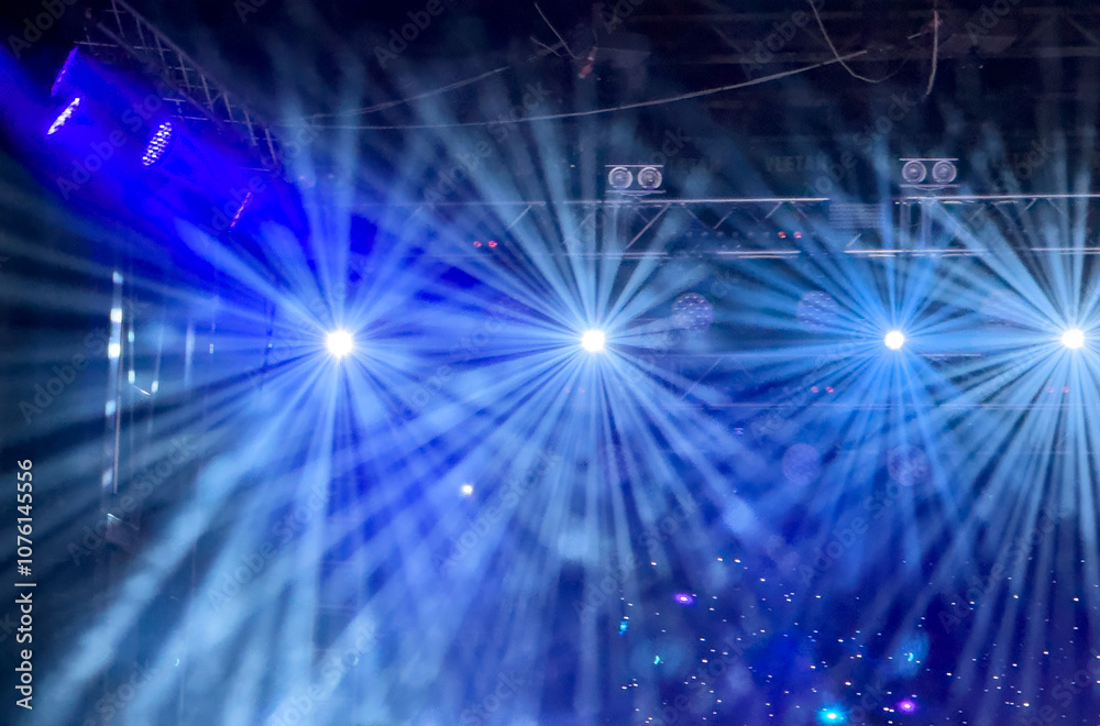 A blue light show with four different lights A blue light show with four different lights