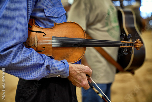 Man holding his Fiddle and bow