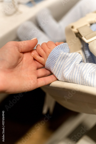 Photography Mother Holding Newborn’s Hand with Soft Touch