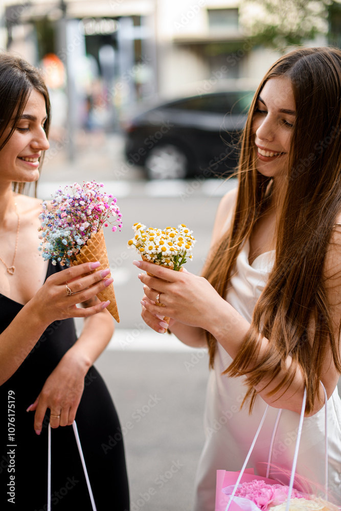 Flower Cone Pair. Two women holding unique small flower bouquets. Flower Cone Pair. Two women holding unique small flower bouquets.