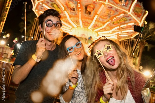A group of friends is enjoying the amusement park
