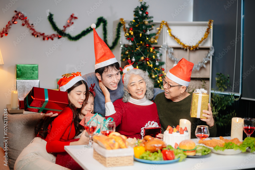 Joyful Asian family gathered for a Christmas feast, exchanging gifts, and celebrating the holiday season with love