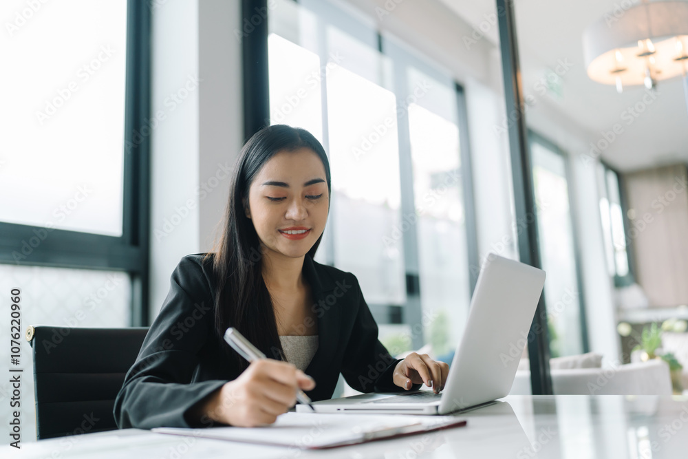 Beautiful Business Woman working by using laptop computer Hands typing on keyboard. Professional investor working new start up project. business planning in office. Technology business Concept Beautiful Business Woman working by using laptop computer Hands typing on keyboard. Professional investor working new start up project. business planning in office. Technology business Concept