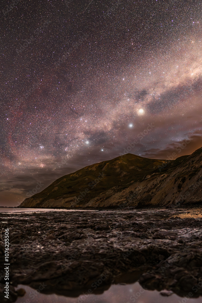 Milky Way galaxy over coastal mountains in New Zealand Milky Way galaxy over coastal mountains in New Zealand