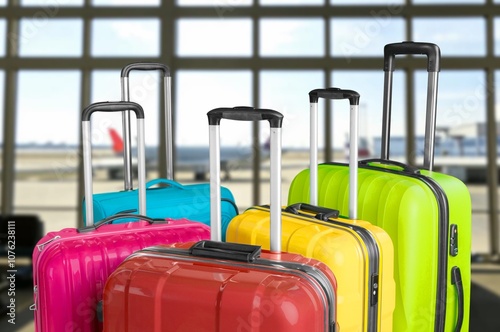 Travel suitcases in airport hall, vacation concept photo